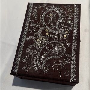 Brown paisley sequined jewelry box with mirror and ring holder.